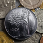 Due Lire del 1958, moneta rara con immagine dell'Olivo, simbolo di valore collezionistico.